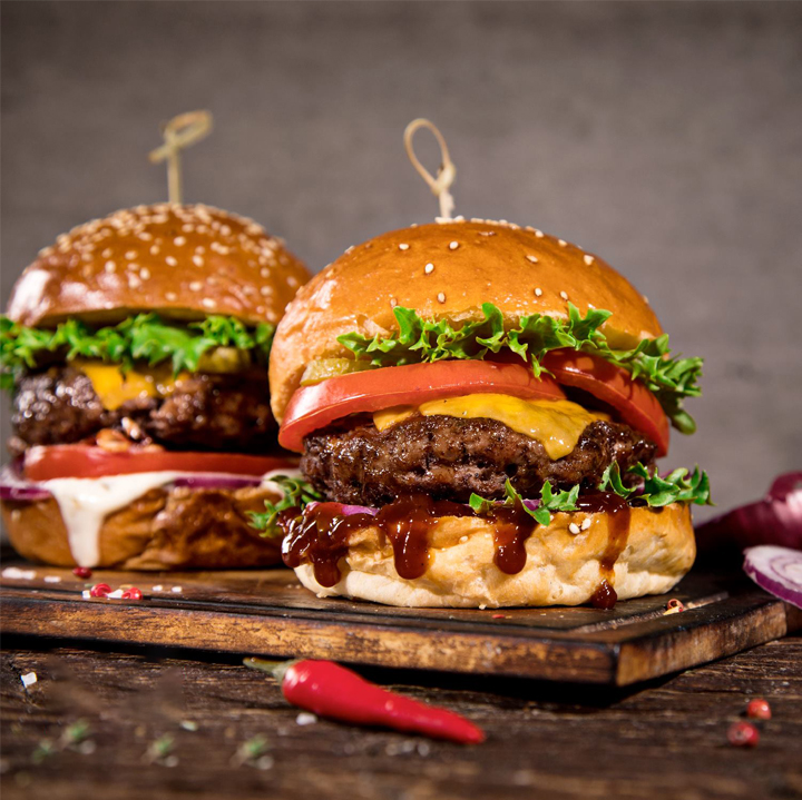 Mega Combo — double burgers stacked and ready to serve