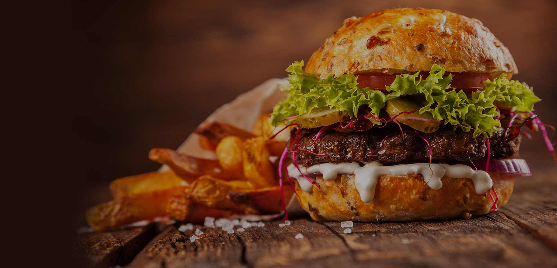 Fresh QuickBite burger loaded with lettuce, tomato and cheese, served with crispy fries